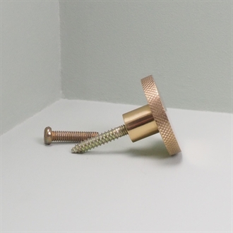 Messingfarvet metal knop/knage med riller